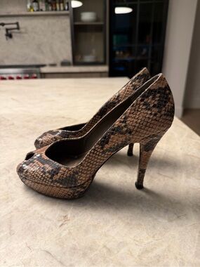 Gently worn Stuart Weitzman Peep-Toe Stiletto Pumps in Snake skin
